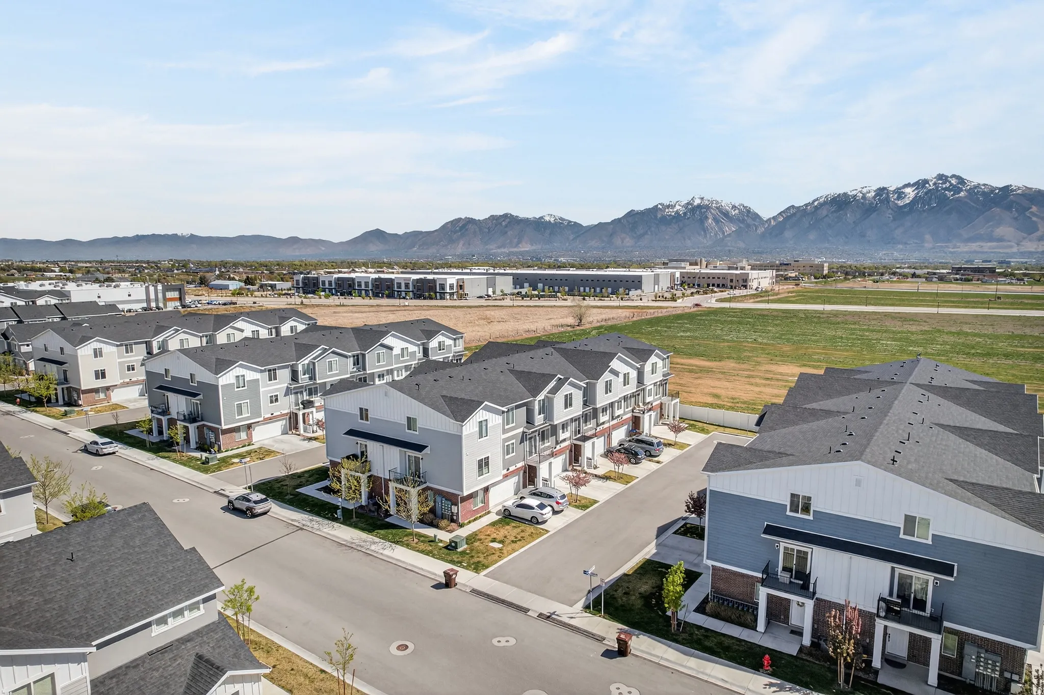 Aerial perspective of suburban area with a mountain backdrop