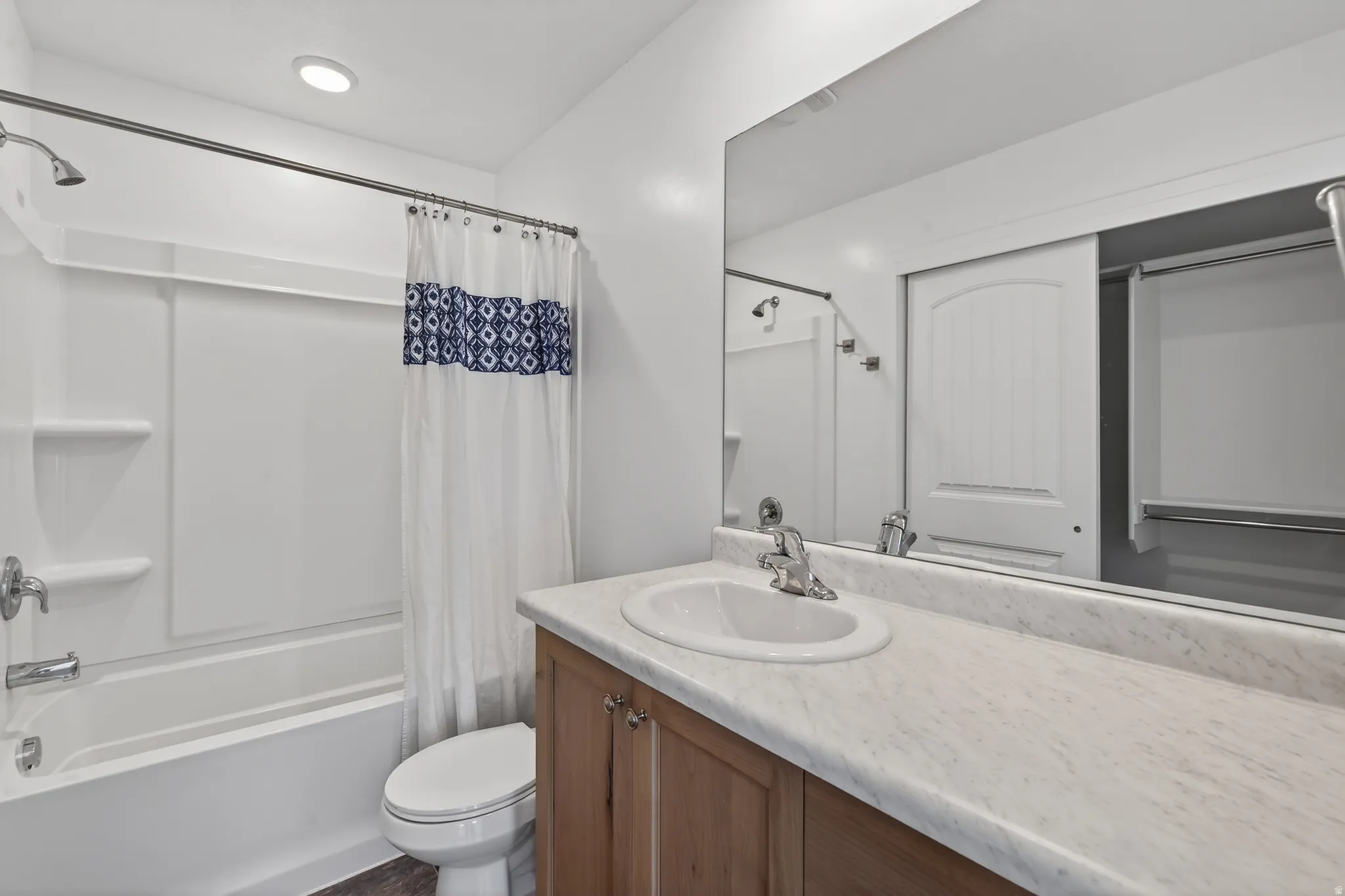 Full bathroom with vanity and shower / tub combo