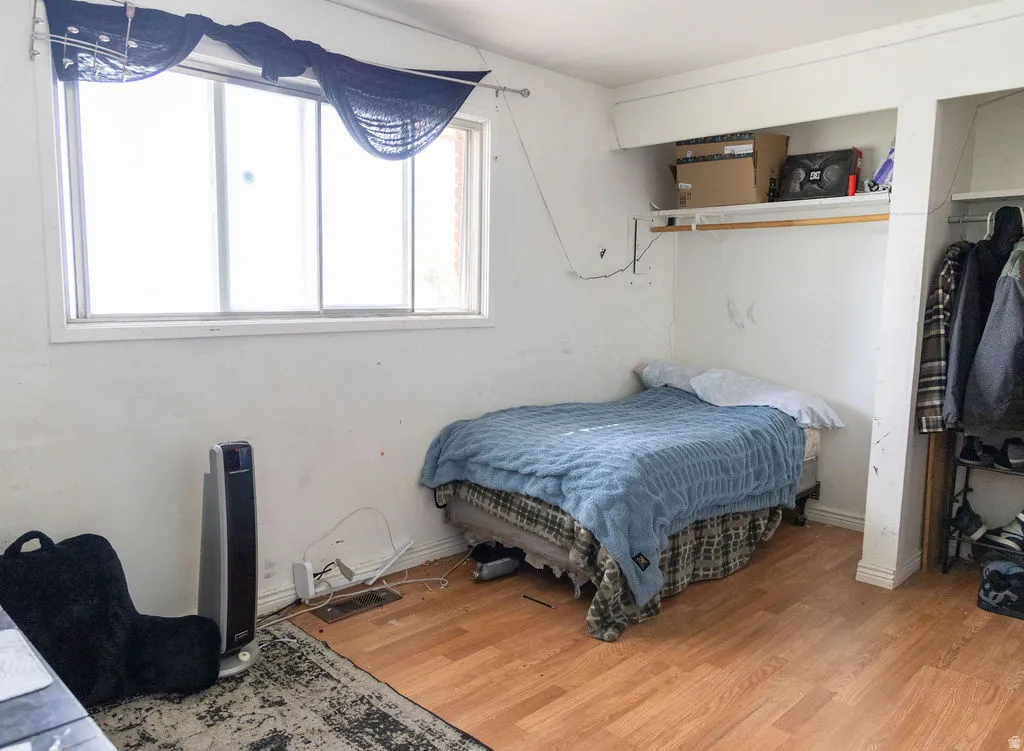 Bedroom with light wood finished floors