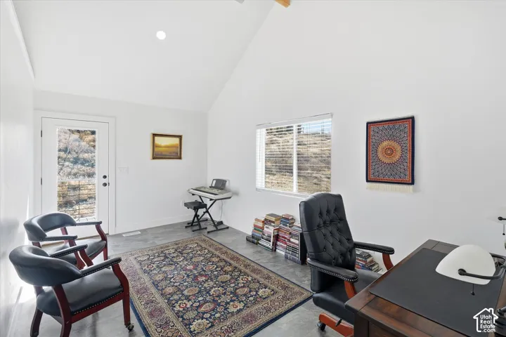 Bedroom/Home office featuring vaulted ceiling, finished floors, and recessed lighting