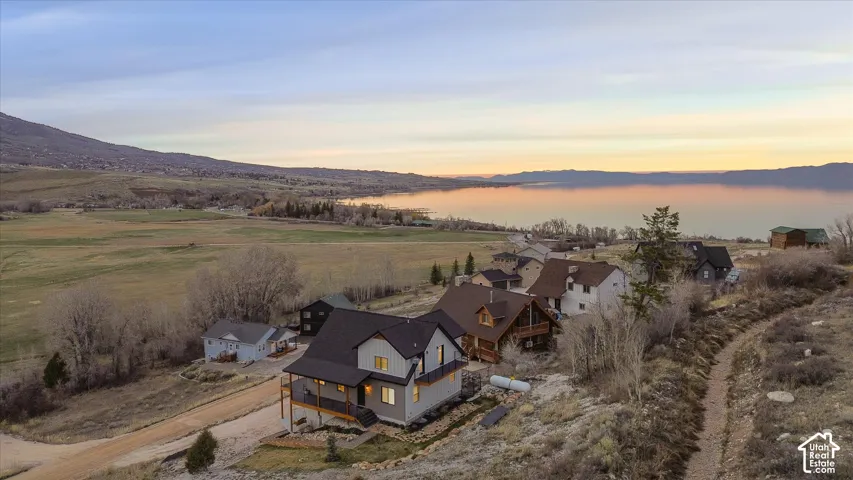 Aerial perspective of suburban area featuring a water and mountain view