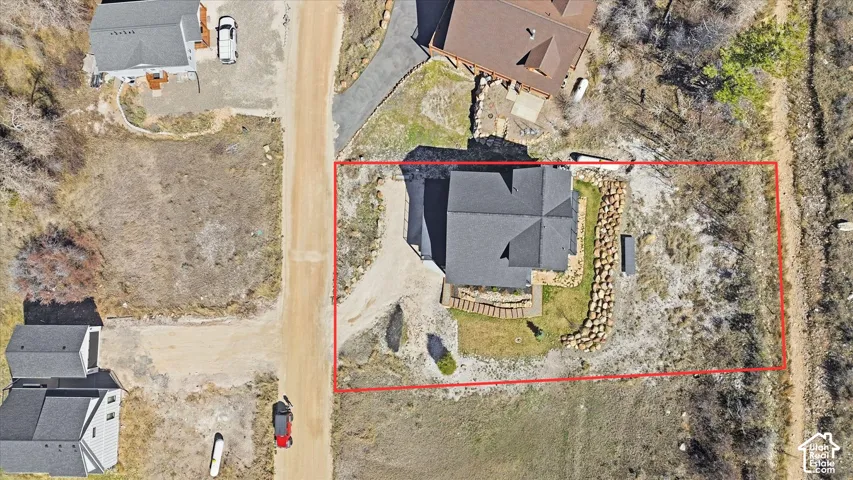 Aerial view of property and surrounding area featuring property boundaries highlighted