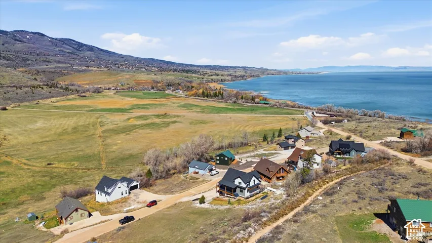 Aerial perspective of suburban area featuring a water and mountain view