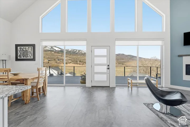 Office area featuring a fireplace and lofted ceiling