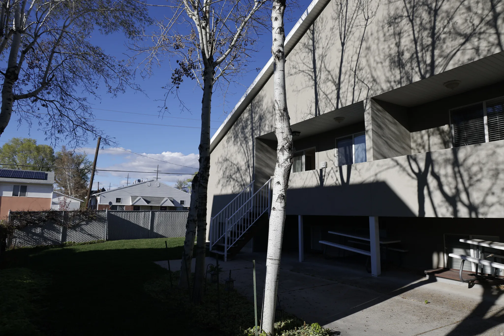 View of side of property featuring stairs