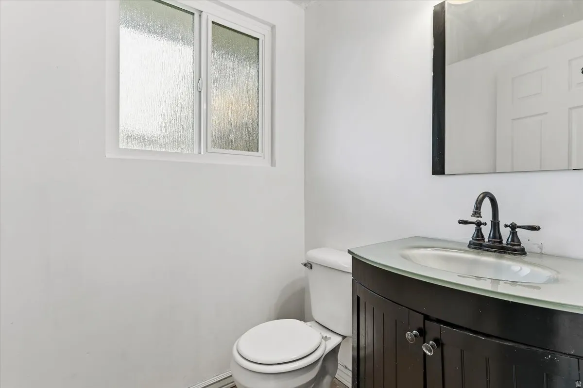 Bathroom featuring vanity and toilet