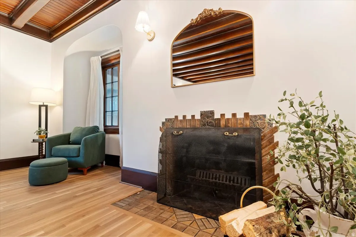 Detailed view of wood finished floors and a wood ceiling with exposed beams