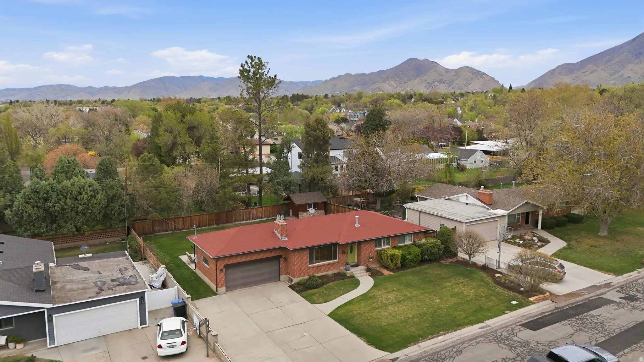 Aerial perspective of suburban area featuring a mountain backdrop