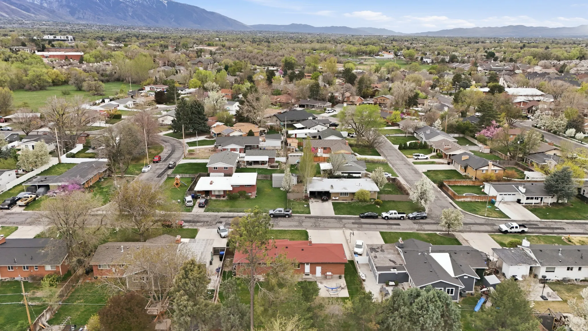 Aerial perspective of suburban area with a mountain backdrop