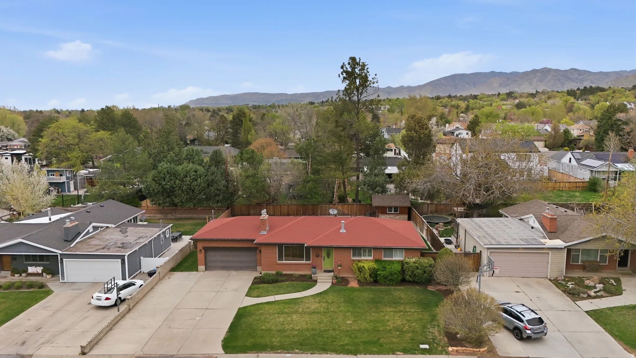 Aerial view of residential area featuring a mountain backdrop