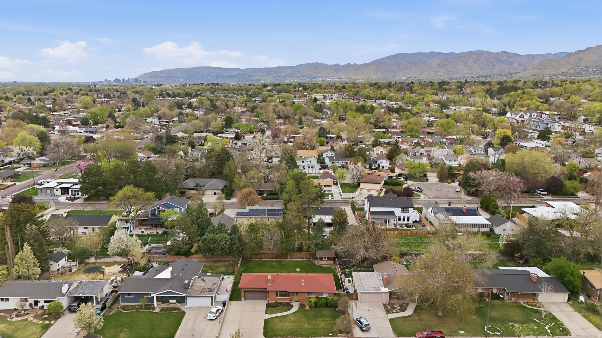 Aerial view of residential area with a mountainous background