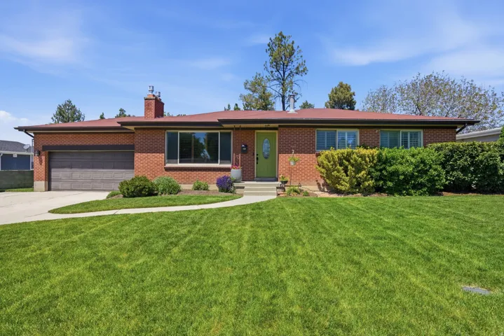 Brick exterior with a red roof