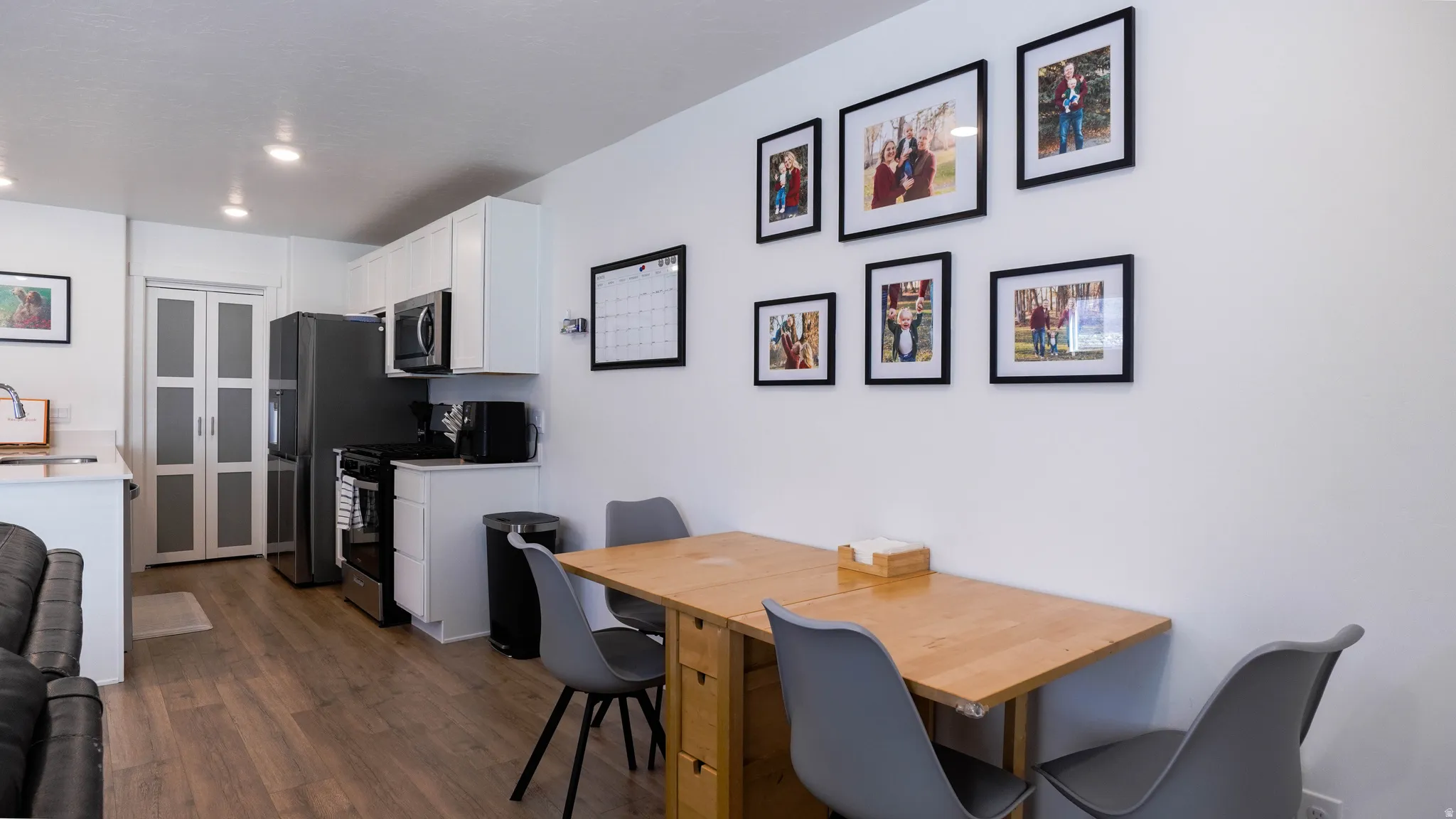 Dining room featuring an office area and dark wood-style floors
