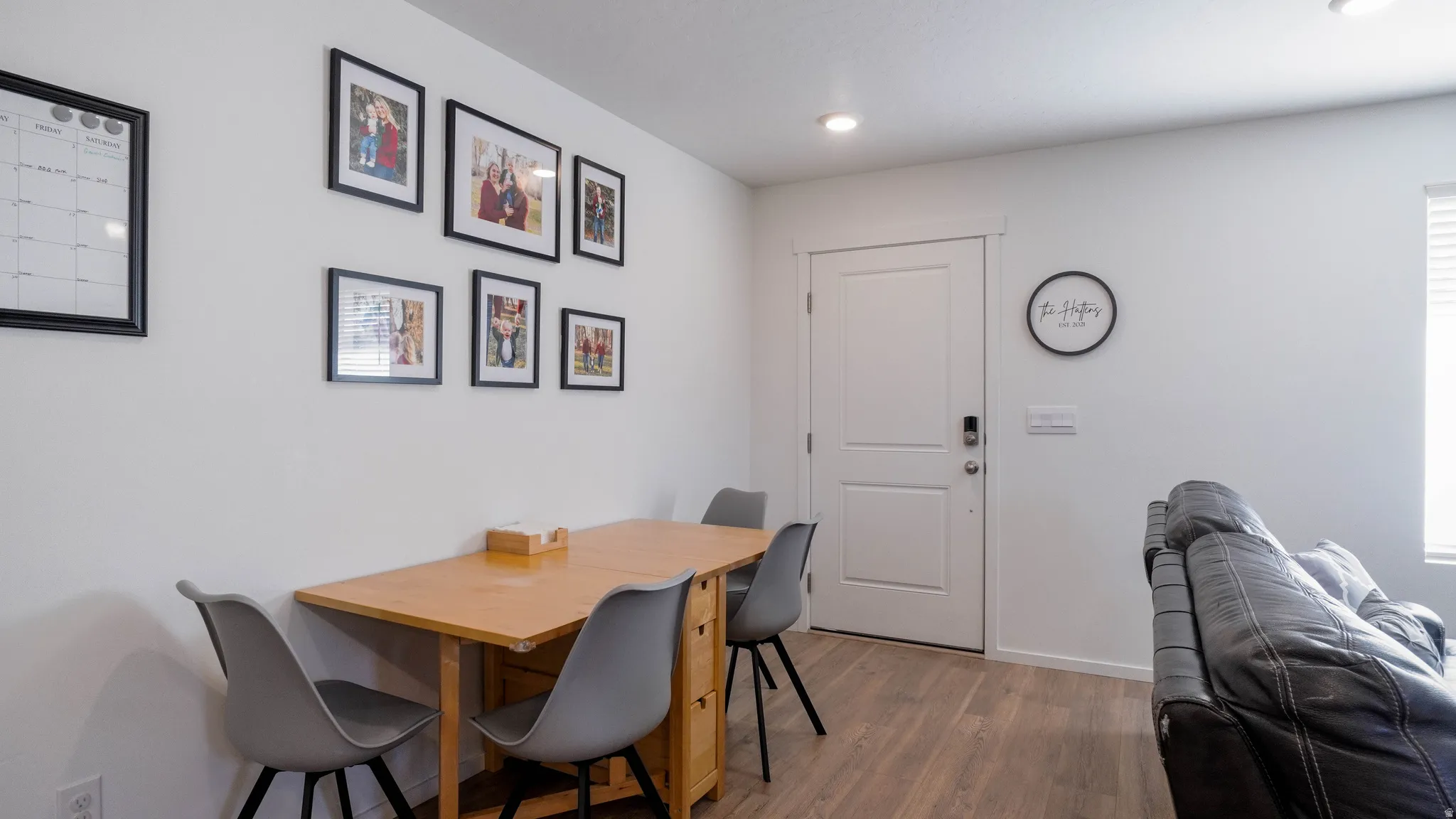 Dining space featuring wood finished floors and recessed lighting
