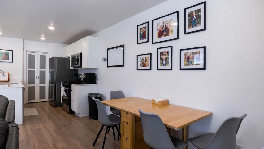 Dining room featuring an office area and dark wood-style floors