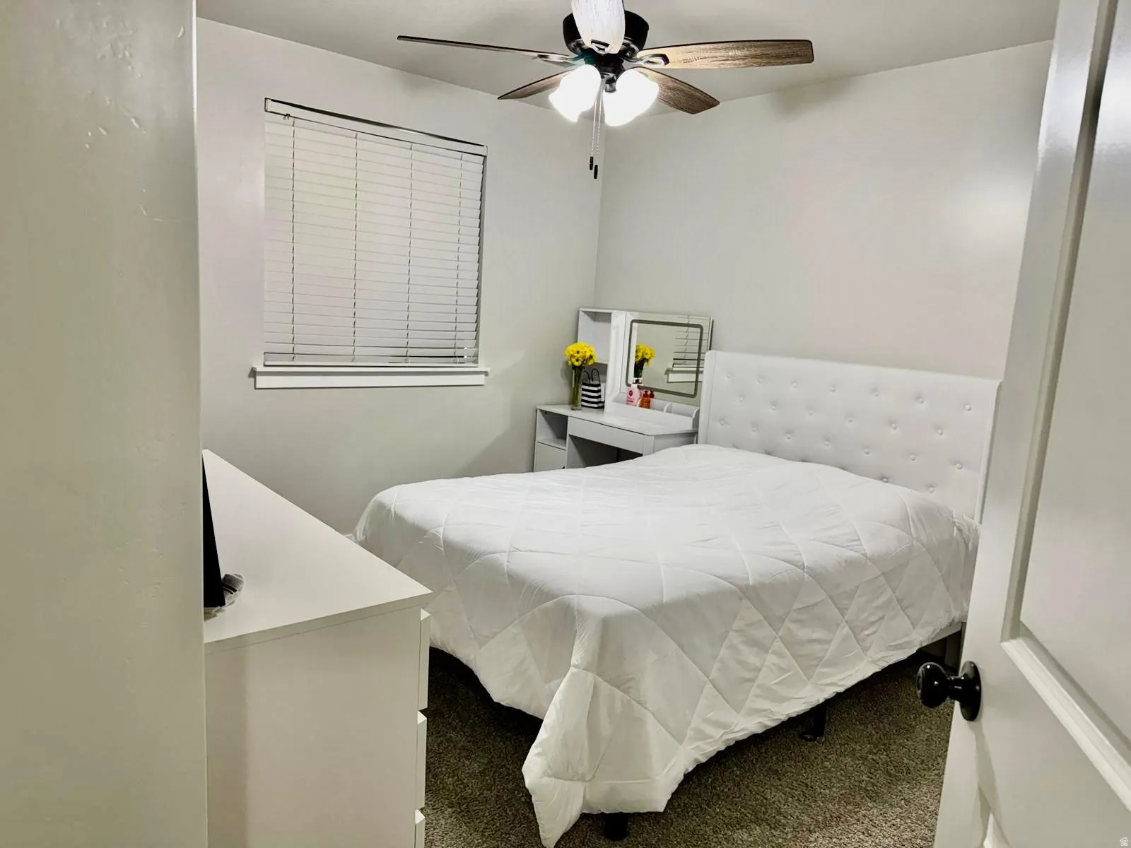 Bedroom with carpet flooring and ceiling fan