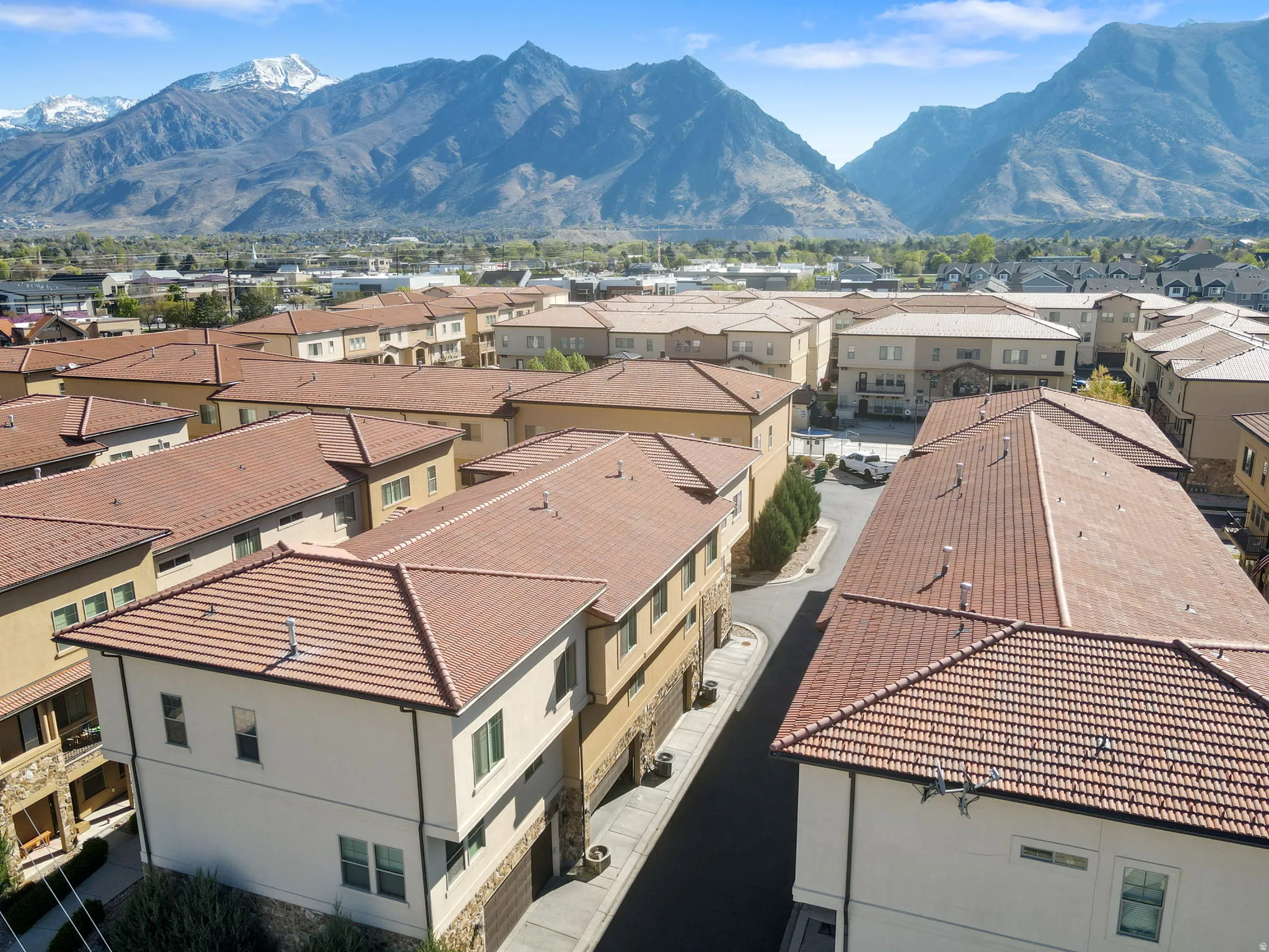 Aerial perspective of suburban area with a mountain backdrop