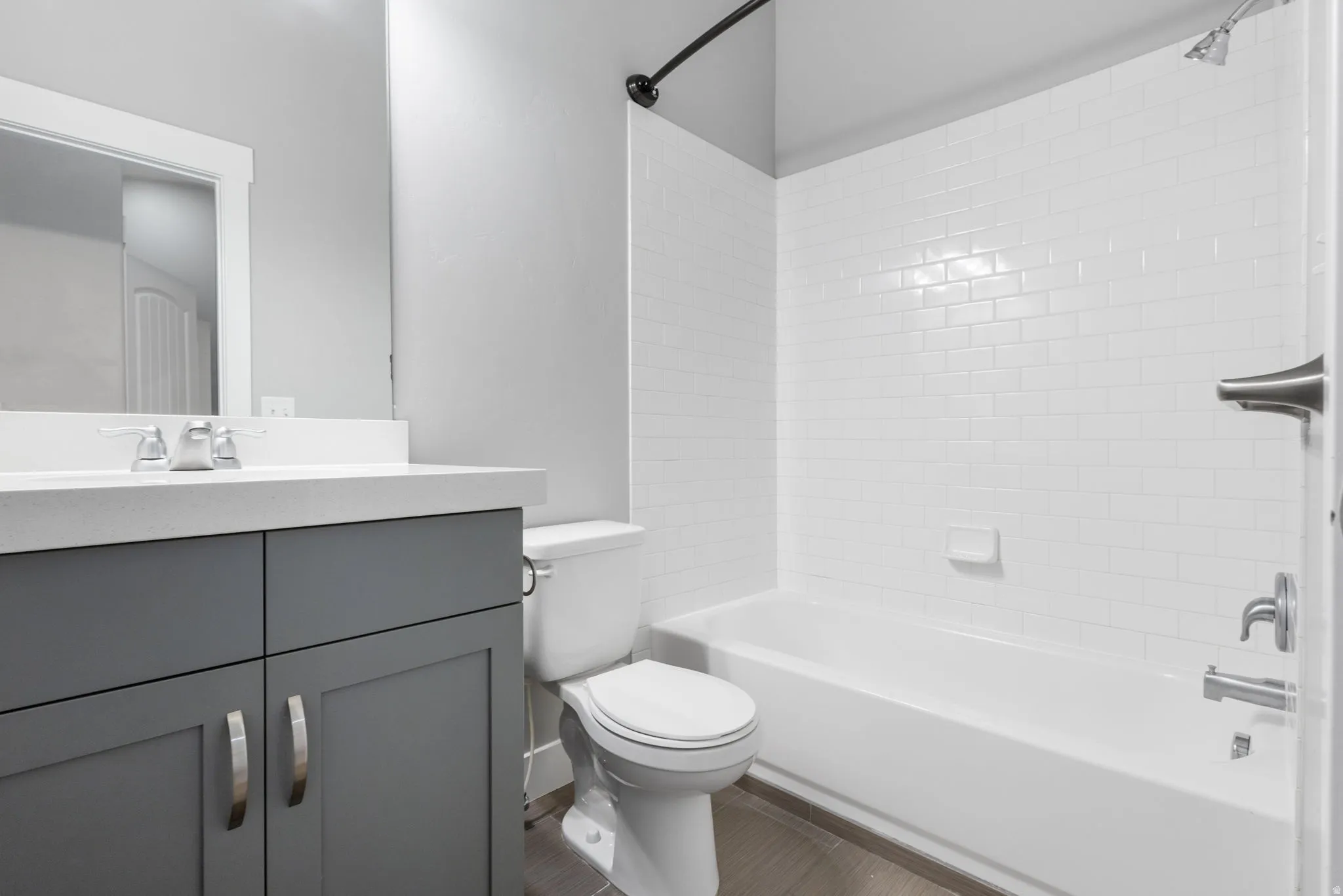 Bathroom with vanity and bathtub / shower combination