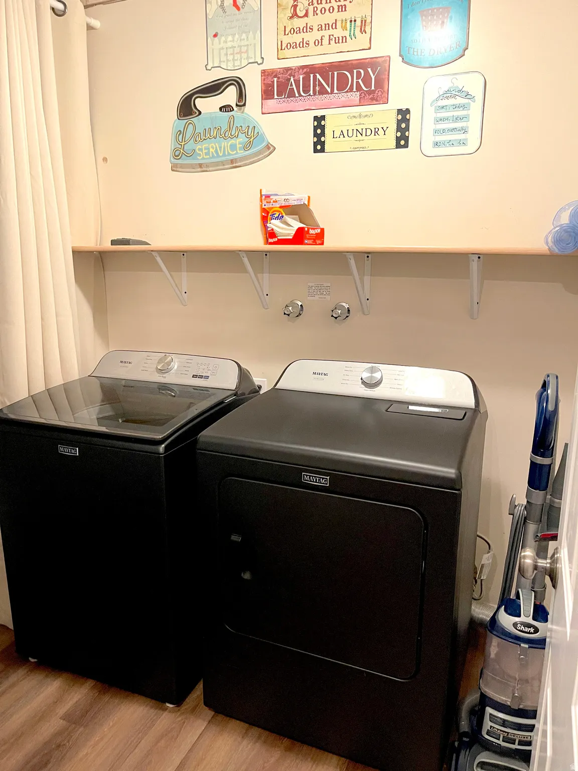 Laundry room with light wood-style flooring
