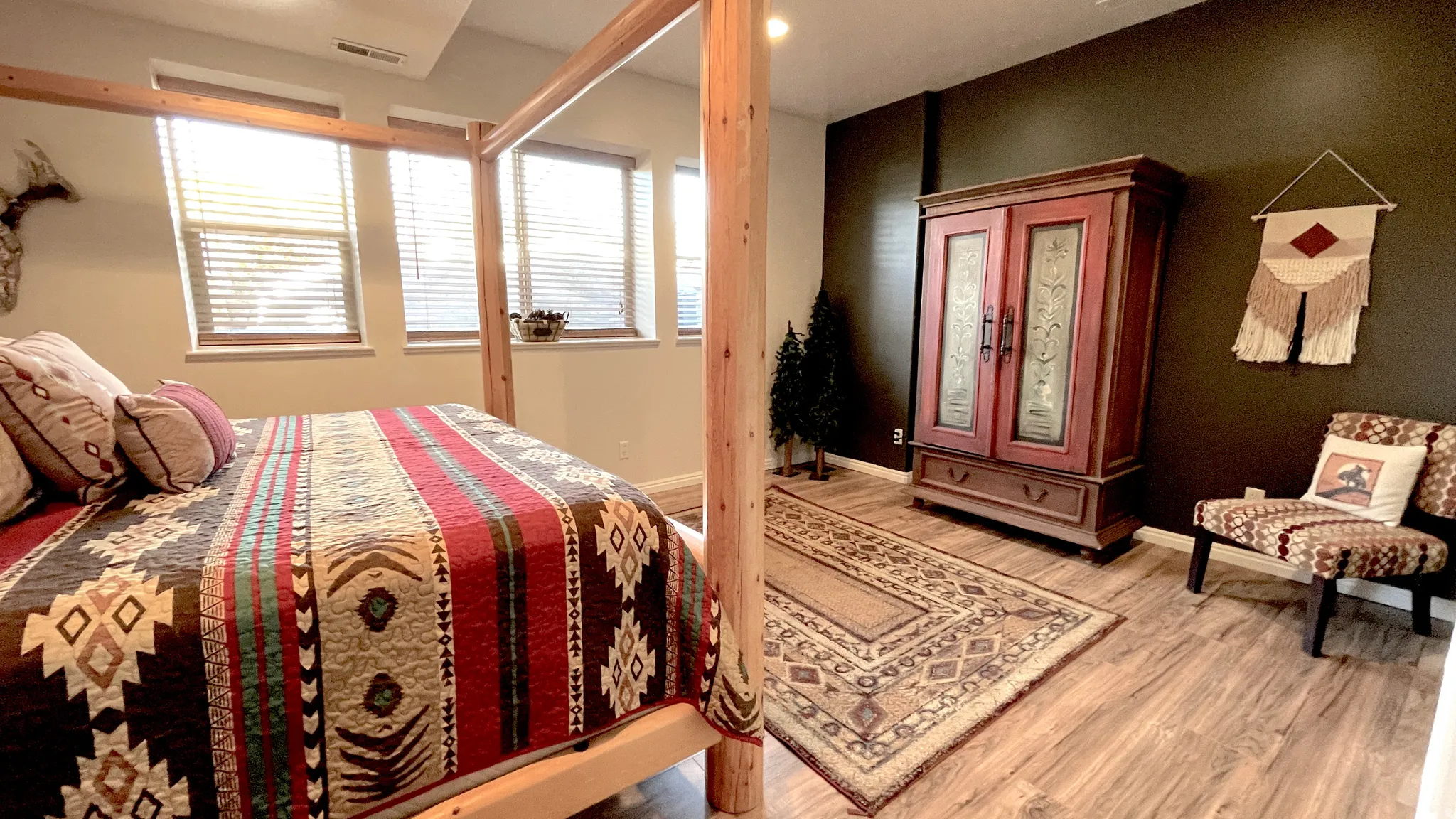 Primary suite featuring light wood-style floors