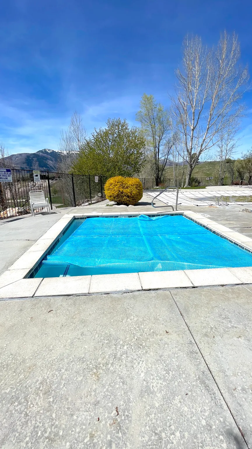 View of swimming pool featuring patio surround