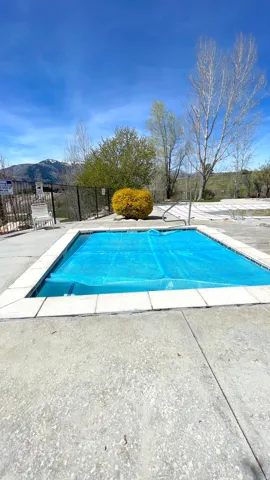 View of swimming pool featuring patio surround