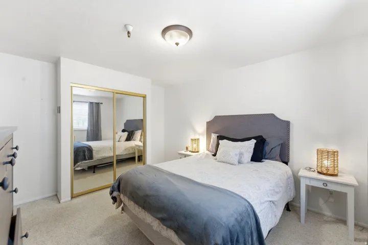 Bedroom with a closet and light carpet
