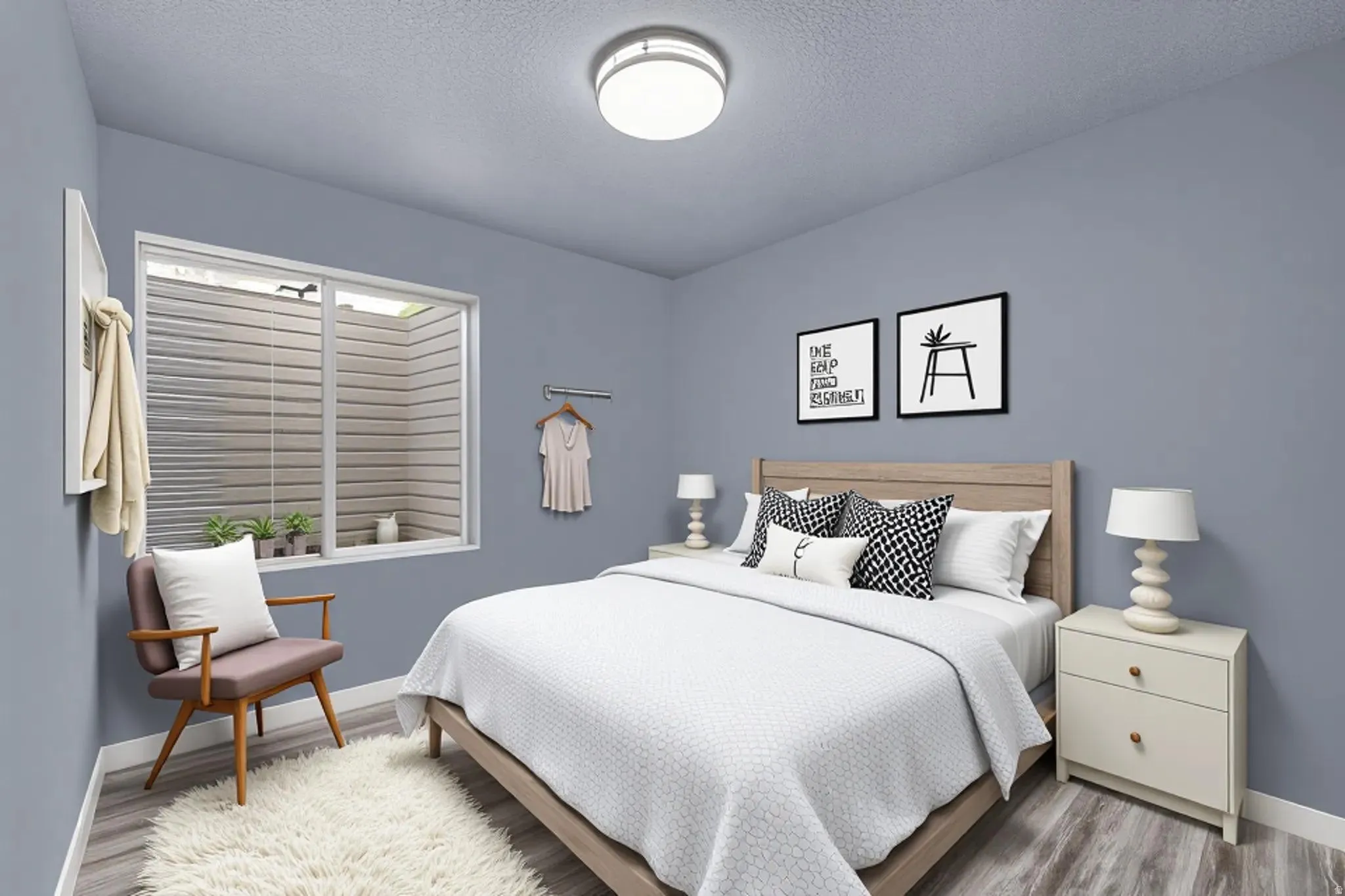 Bedroom featuring wood finished floors and a textured ceiling
