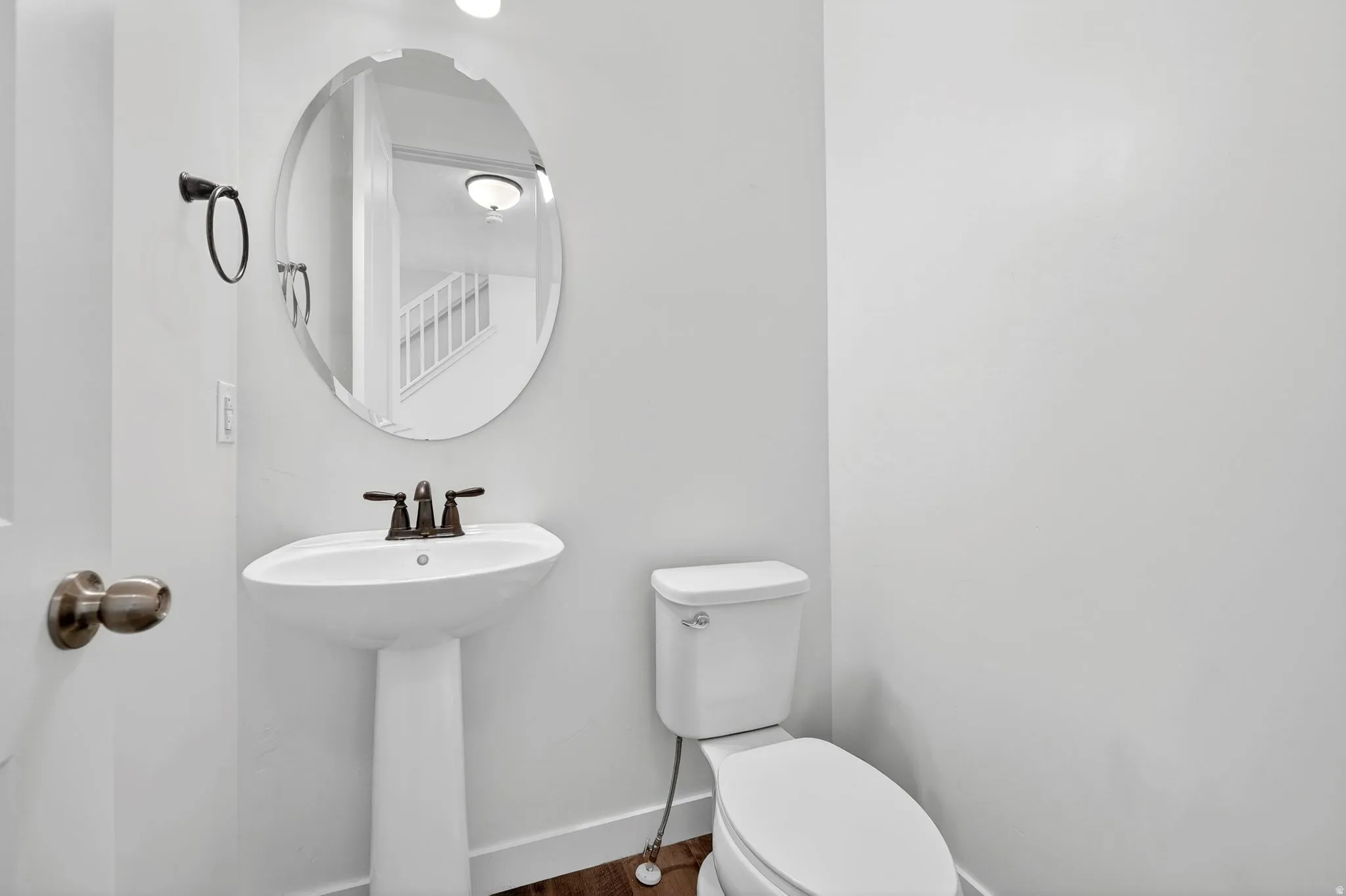 Bathroom featuring toilet and baseboards