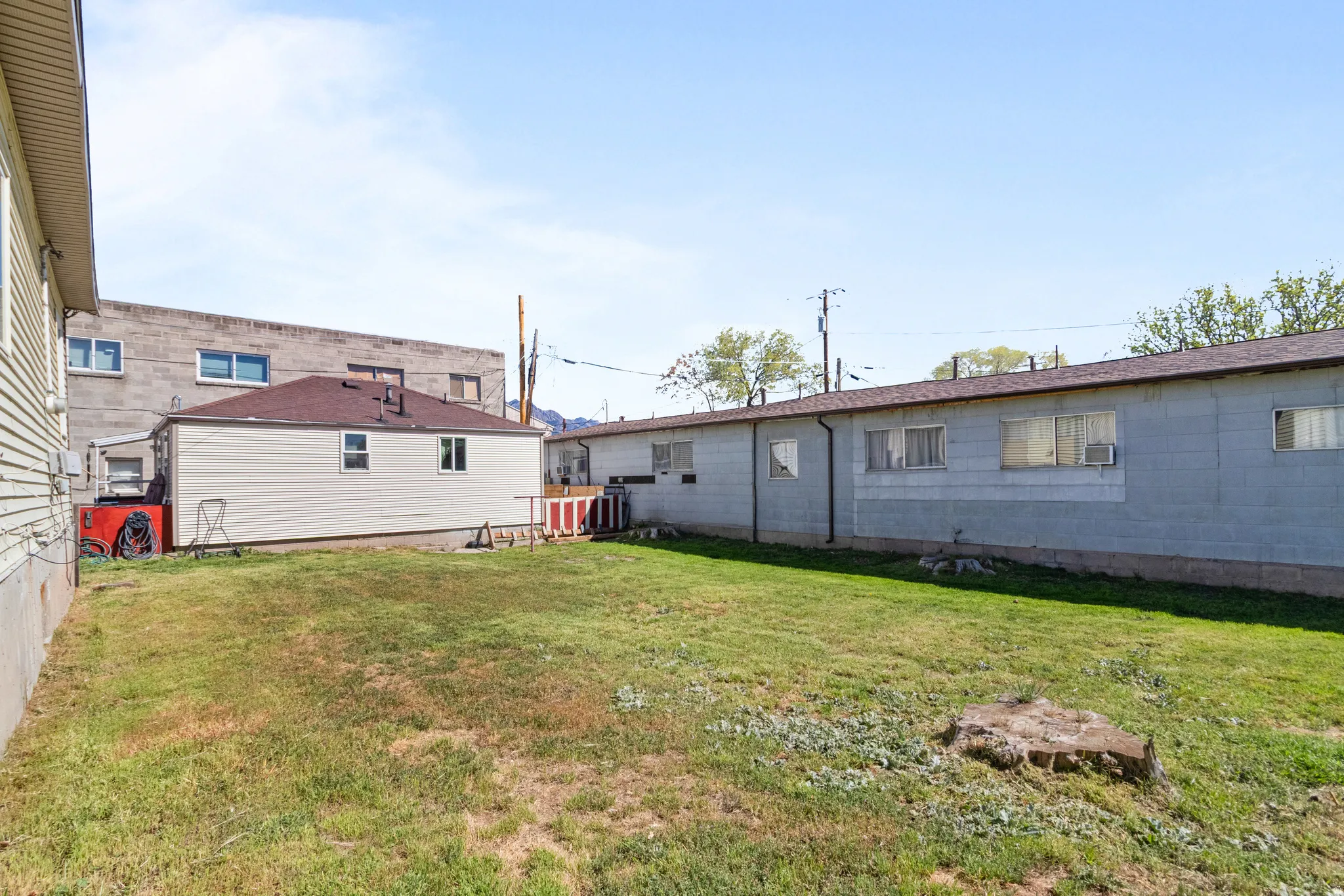 Rear view of house featuring a lawn