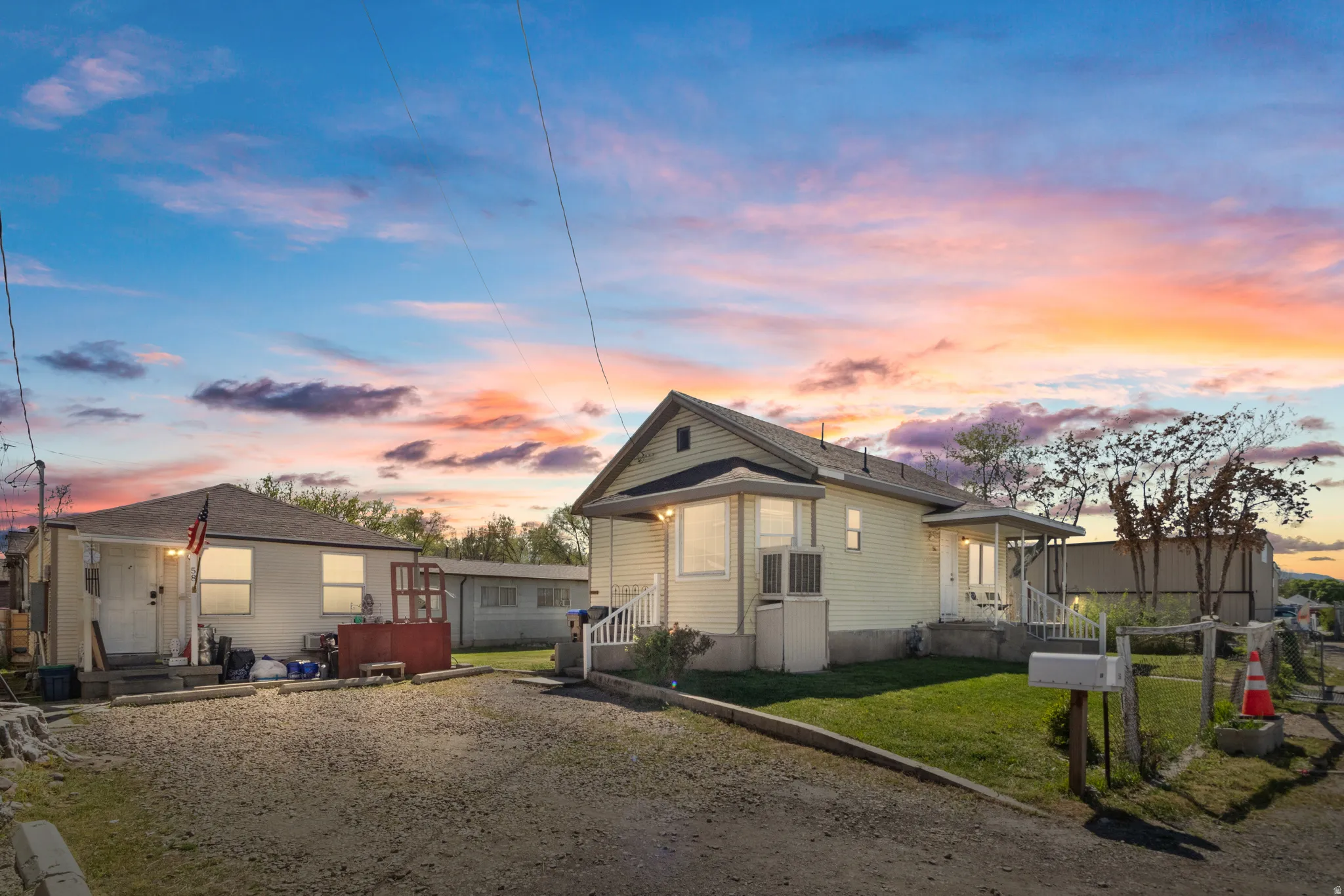 View of front facade featuring a yard and entry steps