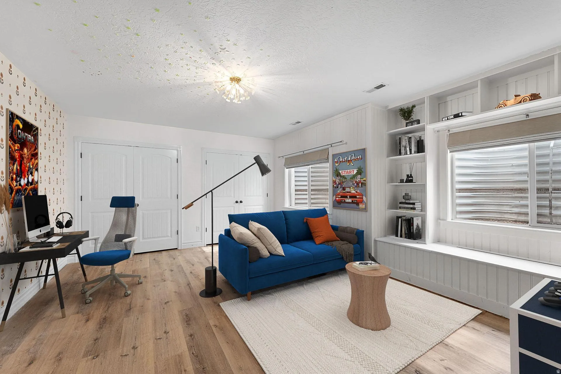 Living area featuring light wood-style flooring, a textured ceiling, and an office area