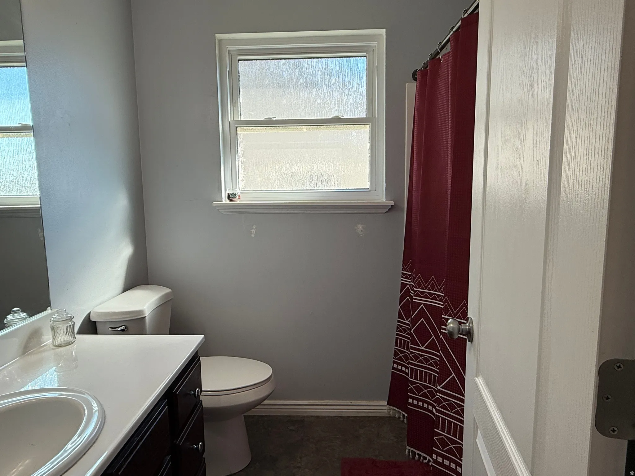 Full bath featuring vanity and a shower with curtain