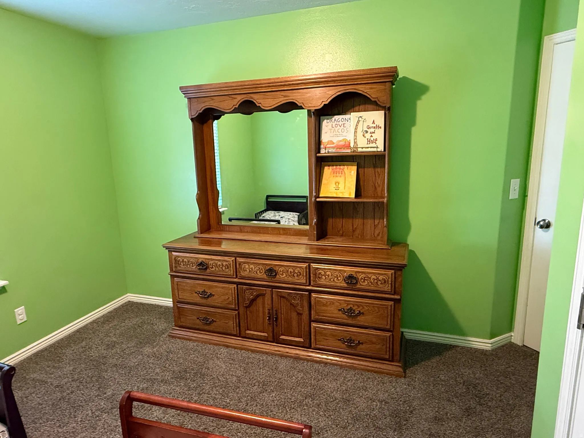 Detailed view of carpet floors and baseboards