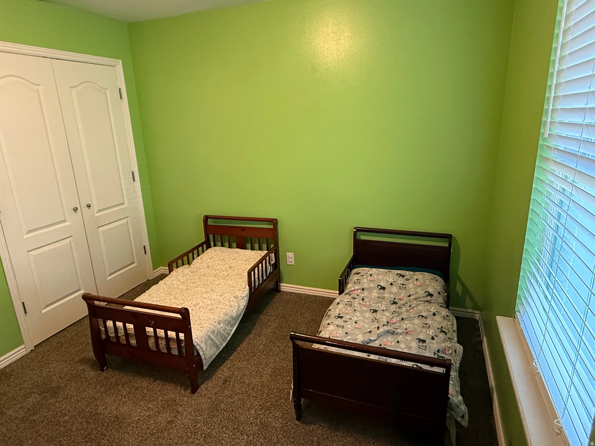 Bedroom featuring a closet and carpet flooring