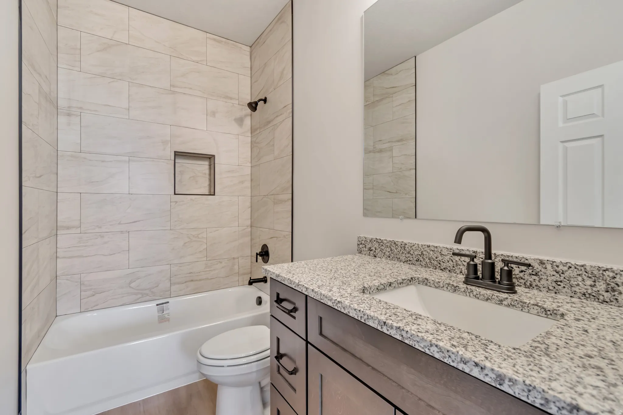 Full bath with vanity and bathing tub / shower combination