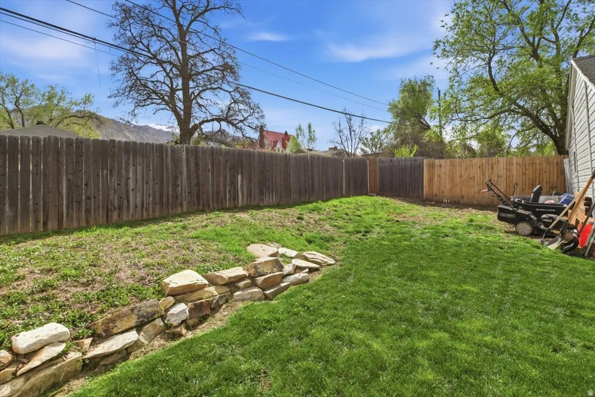 View of fenced backyard