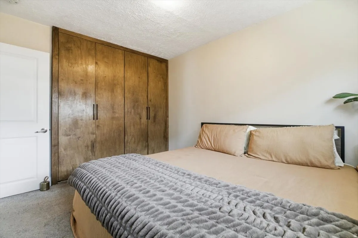 Primary bedroom featuring a closet