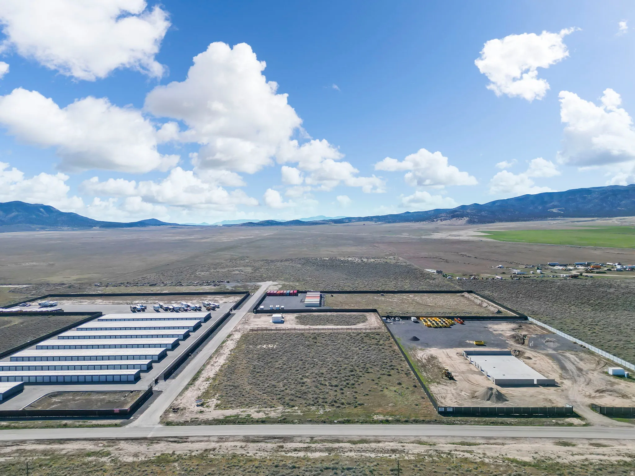 Aerial view of sparsely populated area with a mountainous background