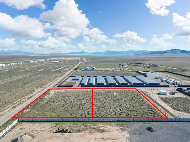 Aerial view of property's location with property parcel outlined and mountains