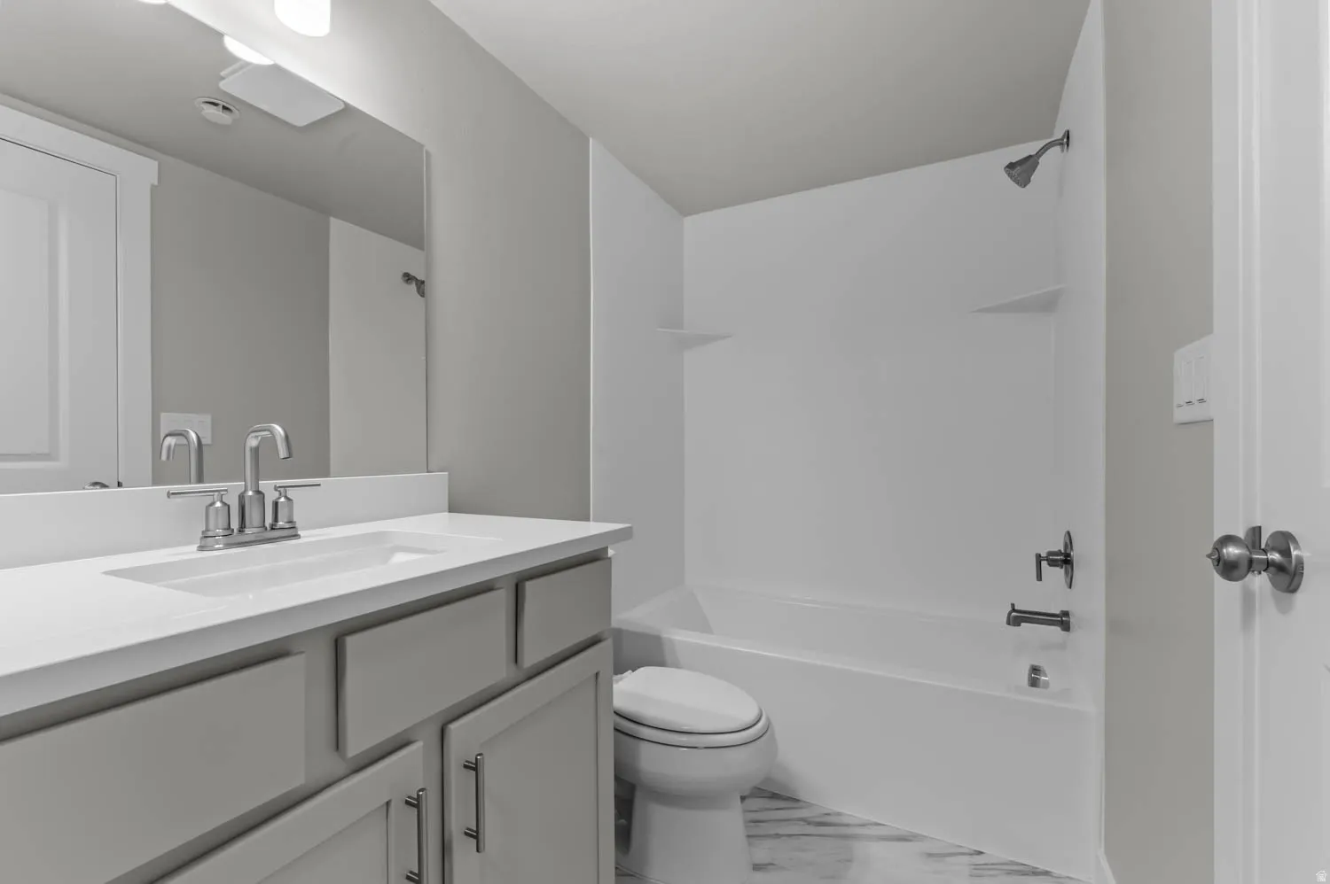 Bathroom with vanity and  shower combination