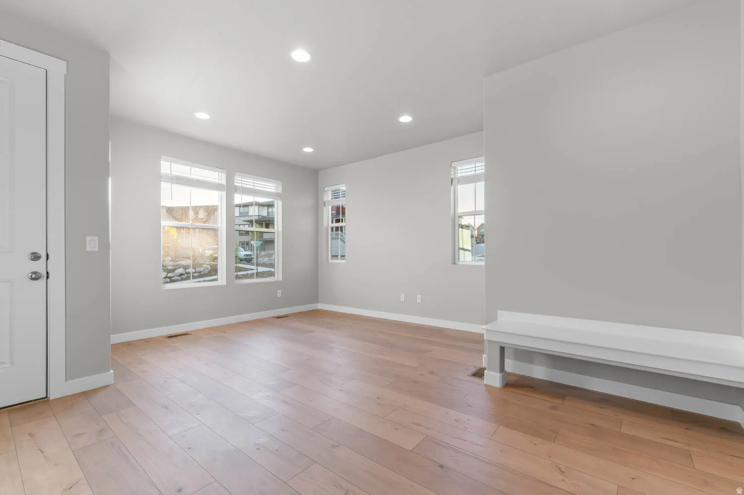 Foyer with recessed lighting and light wood finished floors
