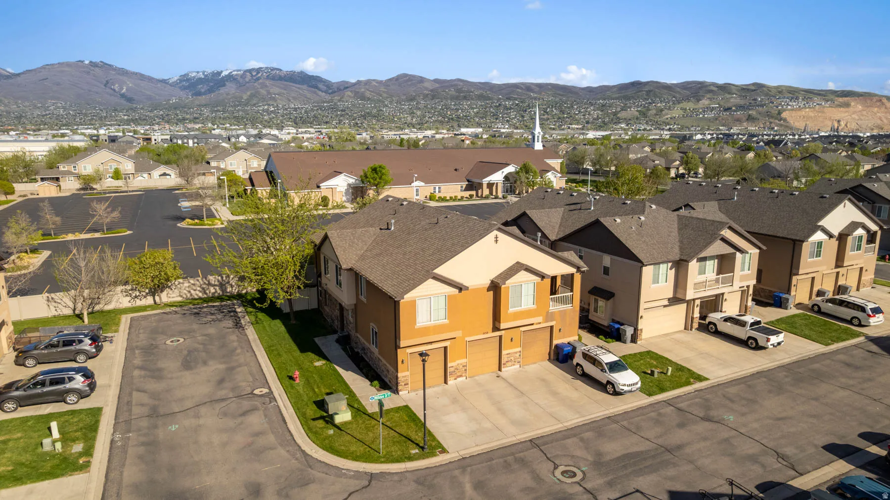 Aerial view of residential area featuring mountains