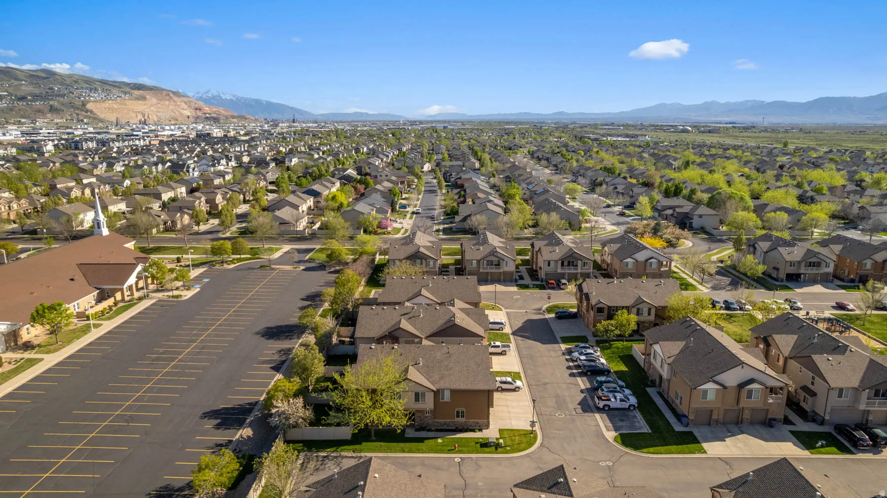 Aerial view of residential area with a mountainous background