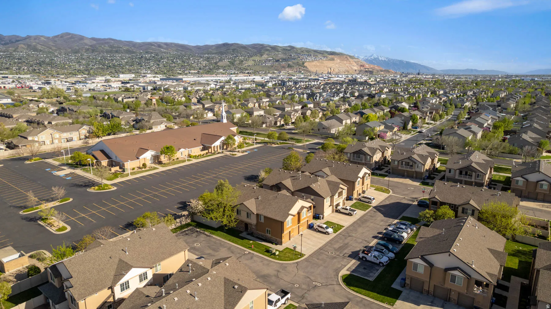 Aerial view of residential area featuring a mountainous background