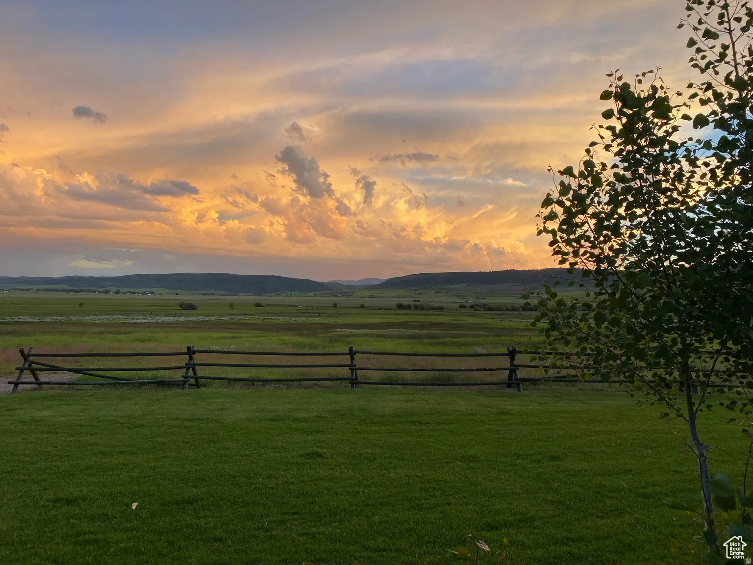 View of yard with a rural view and a mountain view