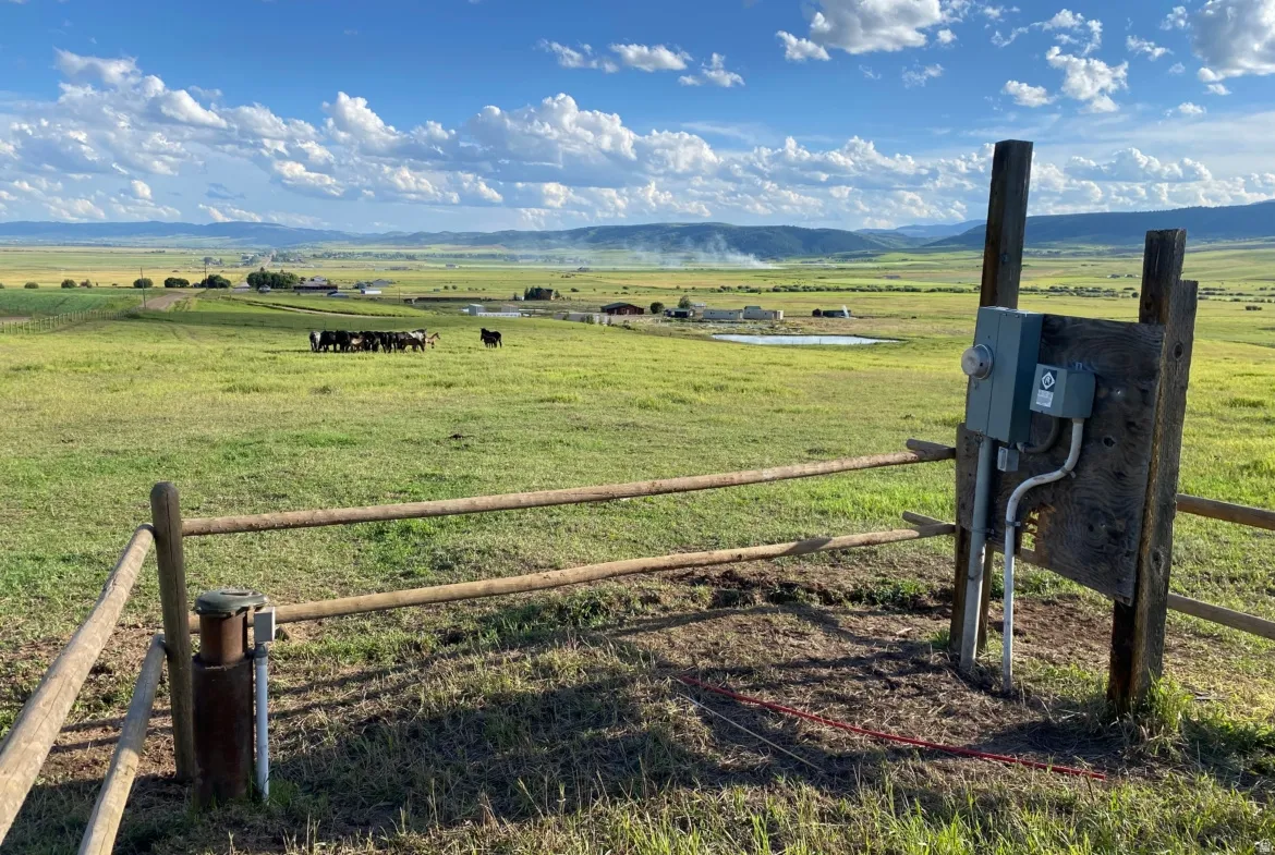 Mountain view featuring a pastoral area and rural landscape