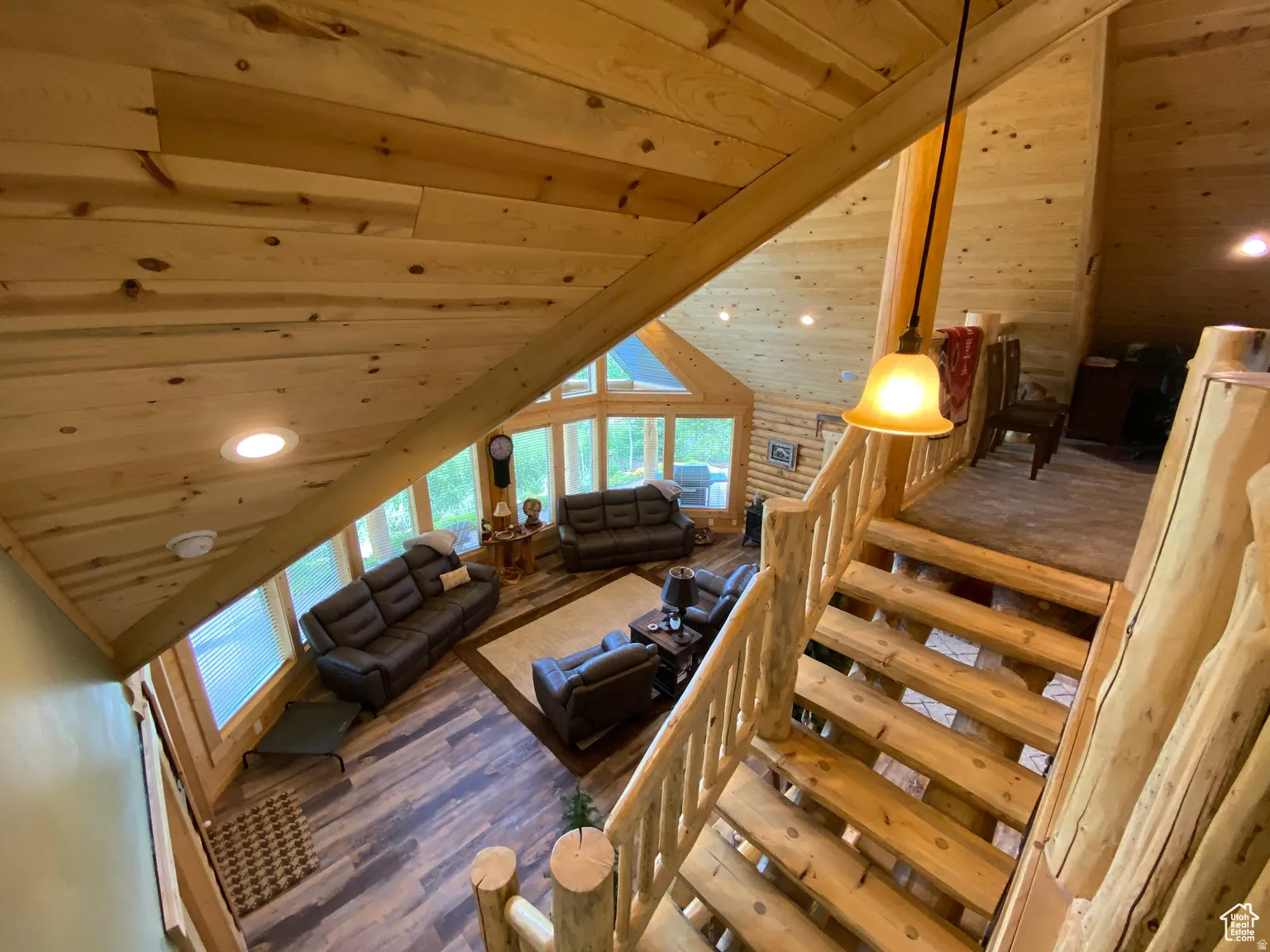 Living area featuring a vaulted wood ceiling, recessed lighting, wood finished floors, and healthy amount of natural light