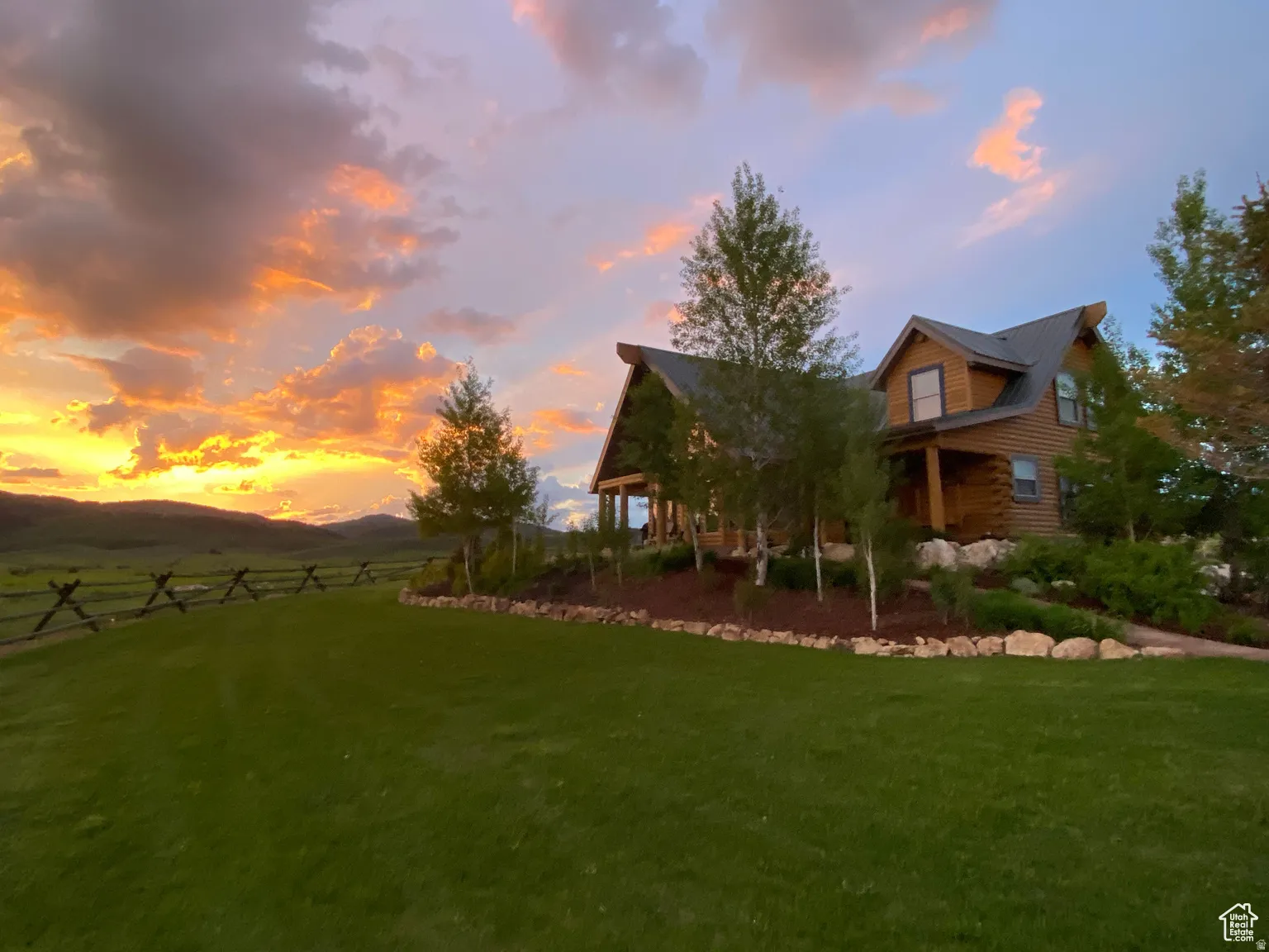 View of yard featuring a mountain view and covered porch