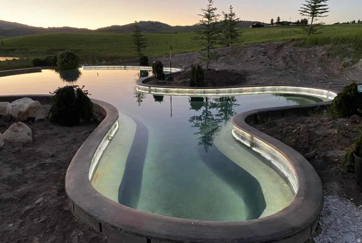 Outdoor pool with a rural view